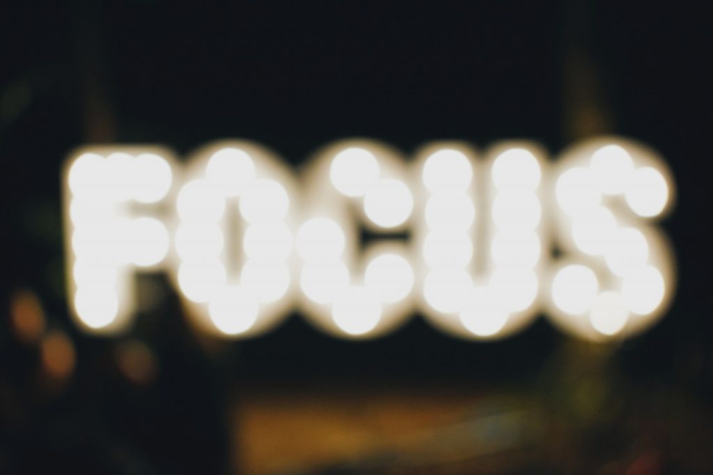 Bokeh effect against lit sign 'Focus'