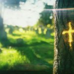 Reflection of cross on tree