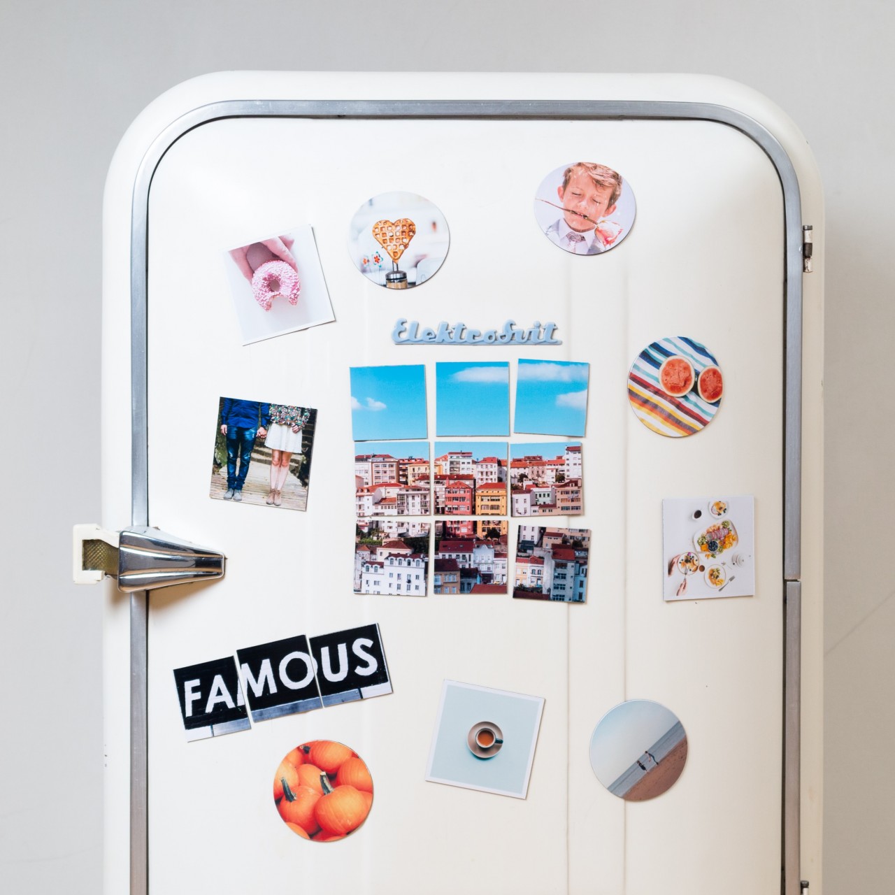 Fridge with magnets and photos on the front
